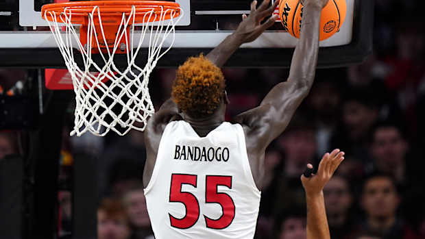 Cincinnati Bearcats forward Aziz Bandaogo (55) blocks a shot in the first half of a college basketball game between the TCU Horned Frogs and the Cincinnati Bearcats, Tuesday, Jan. 16, 2024, at Fifth Third Arena in Cincinnati.